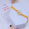 Elegant Kundan Pearl Floral Rakhi